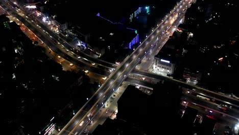 Rajkot-aerial-drone-view-time-lapse-many-high-rise-big-buildings-and-many-vehicles-going-over-bridge