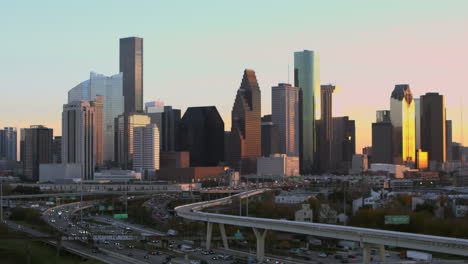 Panning-right-shot-of-downtown-Houston,-Texas-during-sunset