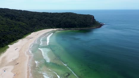 Drone-aerial-landscape-headland-coastline-view-Durras-North-beach-waves-sand-bay-National-park-bushland-tourism-travel-South-Coast-NSW-Australia