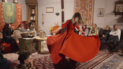 Young-Female-Wearing-Red-Dress-Performing-Sufi-Whirling-Dervishes-Dance-In-Room