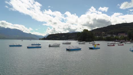 Motorboats-are-parked-in-Annecy-lake-on-a-Cloudy-Day-in-Autumn