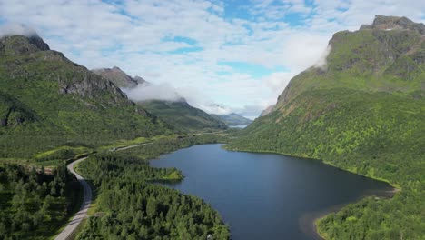 Scenic-Road-through-Fjord-in-Grindoya,-Lofoten-Islands,-Norway---Aerial-4k-Circling