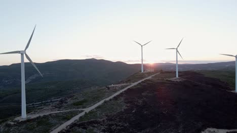 Massive-wind-turbine-towers-in-mountainous-area-of-Valencia-region,-Spain