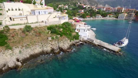 Drone-circling-around-the-tip-of-the-peninsula-in-Agriosiko-Beach,-a-secret-getaway-located-in-the-island-of-Cephalonia-in-Western-Greece