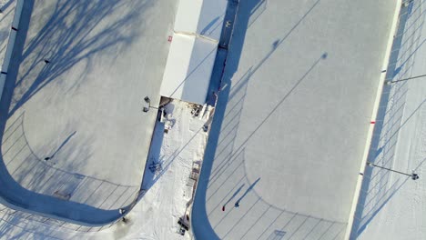 Overhead-aerial-of-outdoor-hockey-rinks-in-Canada,-4K