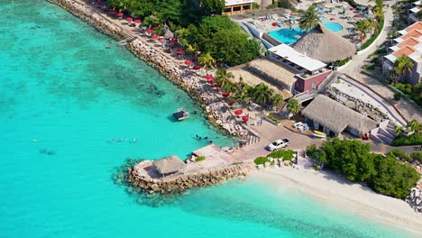 Drone-left-to-right-orbit-around-Karakter-beach-luxury-resort-getaway-destination-in-Caribbean