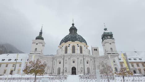 Facade-Of-Ettal-Abbey-Monastery-During-Snowy-Winter-Near-Oberammergau,-Germany