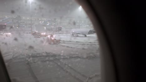 Passenger-POV-Looking-Through-Window-Leaving-Munich-Airport-In-Winter