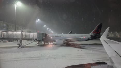 Snow-Falling-At-Night-In-Munich-Airport-During-Winter-In-Germany