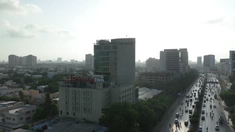 Aerial-Time-lapse-Sunlit-Nursery-Flyover-on-Shahrah-e-Faisal,-Karachi