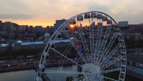 Giant-wheel-turns-slowly-for-tourists-to-get-a-sunset-view-of-Old-Montreal