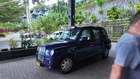 Limousine-pulling-into-driveway-of-The-Senses-Resort-in-Phuket,-Thailand