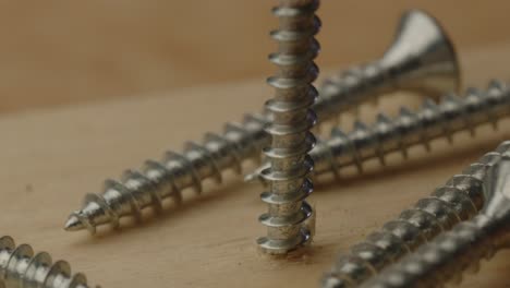 Macro-view-of-screw-rotating-into-wooden-beam-in-240fps-slow-motion