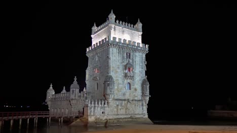 Illuminated-Belém-Tower-at-night,-Unesco-World-Heritage-in-Lisbon,-Portugal