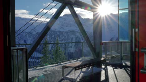 Ski-station-with-different-modes-of-transportation-going-up-and-down-the-mountains-such-as-ski-lifts,-chair-lifts,-and-cable-cars,-located-at-Engelberg,-in-Brunni,-Switzerland