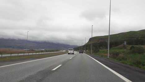 POV-driving-car-on-the-highway-in-Reykjavik,-Iceland
