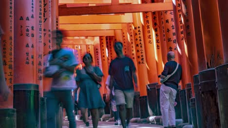 Time-lapse-of-people-Tourists-walking-through-the-Famous-Fushimi-Inari-Torii-Gates-Shrine,-Kyoto,-Japan-View-2