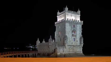 Lit-up-Belém-Tower-from-front-view-in-the-evening-in-Lisbon,-Portugal