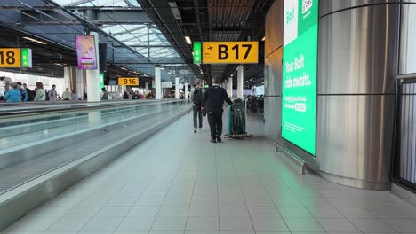 POV-Of-Person-Walking-At-Amsterdam-Airport-Schiphol-In-Schiphol,-Netherlands
