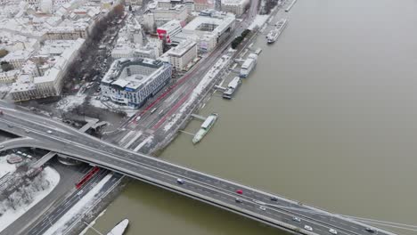 Aerial-drone-view-of-SNP-bridge-and-old-town-with-modern-buildings-of-Bratislava-downtown-in-winter