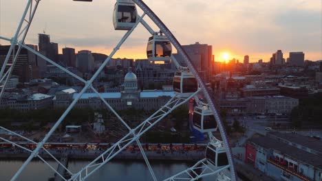 Old-Montreal-skyline-with-largest-observation-wheel,-La-Grand-Roue-de-Montreal,-in-foreground