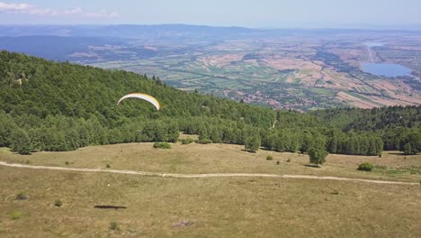 Paraglider-flying-very-slow-above-forest