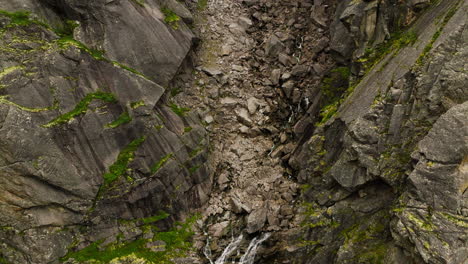 Waterfalls-Over-Cliffside-In-Hellmojuvet-Alpine-Canyon-In-Northern-Norway
