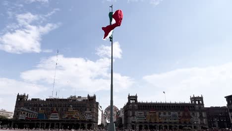 slow-motion-shot-of-mexican-flag-flying-on-the-zocalo