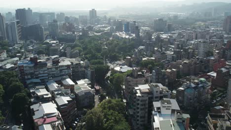 Aerial-drone-top-down-shot-over-the-city-of-Xinbeitou-in-Beitou-district,-Taipei,-Taiwan-on-a-bright-sunny-day