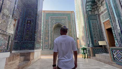 Young-Man-Admires-Mausoleum-of-Khoja-Ahmad-at-Shah-i-Zinda,-Samarkand,-Uzbekistan