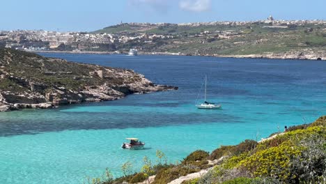 4K-handheld:-Motorized-boat-in-Blue-Lagoon,-Comino-Island,-Malta