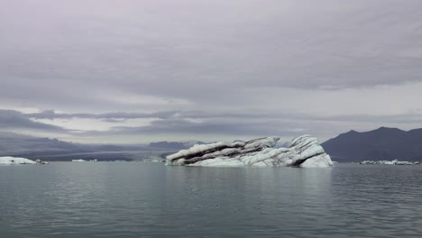 Iceberg-In-Sea-Of-Diamond-Beach-Near-Glacier-Lagoon-Of-Iceland---Drone-Shot