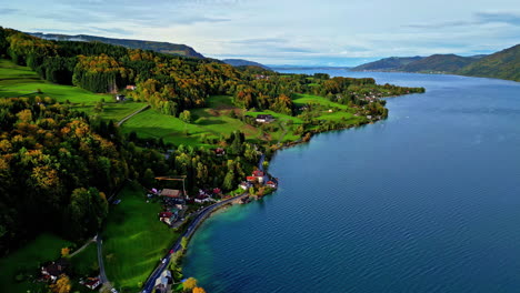 Cinematic-drone-shot-of-village-near-Attersee-Lake-in-the-Austrian-Alps,-Scenic-European-town-in-the-hills,-Austria,-Europe