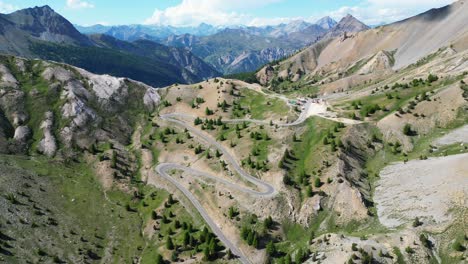French-Alps-Col-Izoard-Mountain-Pass-and-Cycling-Stage-in-Tour-de-France---Aerial-4k