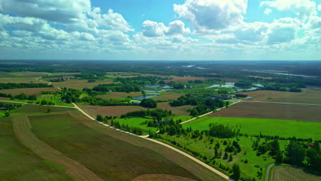 Aerial-drone-shot-over-a-Latvian-landscape-in-daylight-time