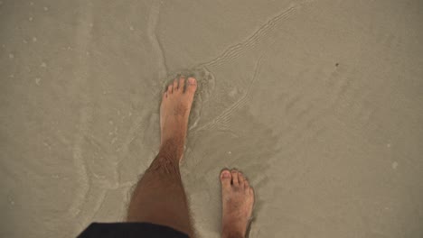 a-man-walking-on-a-beach-4K-UHD