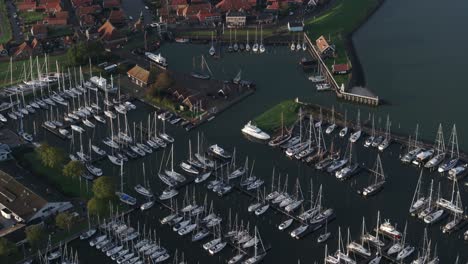Aerial-drone-view-of-harbour-of-Hindeloopen-with-sail-boats,-Friesland,-Holland