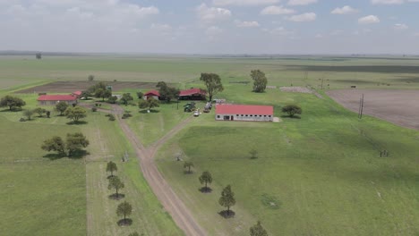 Aerial-4k-drone-footage-circling-around-a-farm-house-in-Free-State,-South-Africa