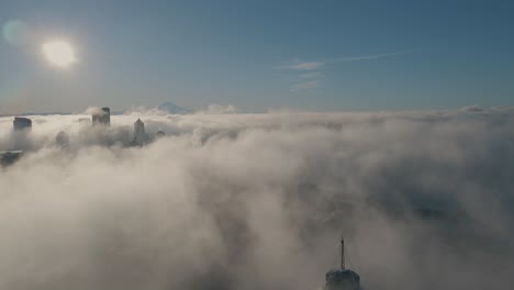 Aerial-pullback-brings-iconic-city-skyline-needle-into-view-shrouded-in-fog