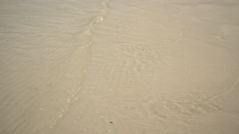ocean-waves-calmly-glide-through-the-sand-4K-UHD