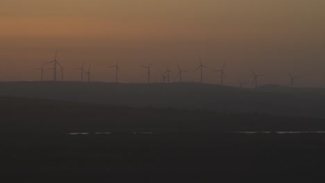 Witness-the-serene-spectacle-of-windmills-silhouetted-against-the-sunset