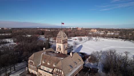 Winnipeg's-Assiniboine-Park-pavilion-in-winter,-4K-aerial