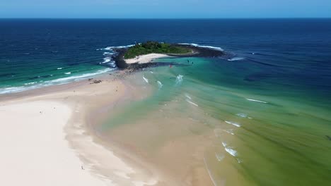 Drone-aerial-landscape-of-waves-ocean-sandy-beach-windsurfing-Summer-travel-tourism-Green-Island-Bendalong-South-Coast-Australia