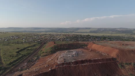 A-push-in-drone-shot-showcases-a-substantial-waste-processing-site-within-the-suburban-township-area-of-Pretoria