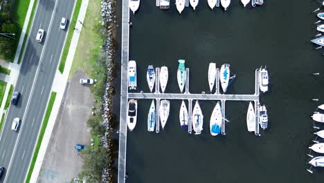 Drone-aerial-waterfront-boat-yacht-sailing-dock-wharf-waterfront-roads-cars-transport-street-Catalina-Batemans-Bay-South-Coast-tourism-travel-Australia