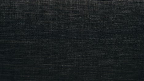 Slow-Pan-In-Background-Back-Drop-Material-Organic-Large-Black-Grey-Charcoal-Threaded-Polyester-Cotton-Wool-Sofa-Couch-Arm-Texture-Soft-Luxurious-Warm-Stitched-Synthetic-Materials