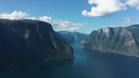 Aurlandsfjord-aerial-high-speed-forward-flight-over-the-fjord-between-the-mountains-peeks