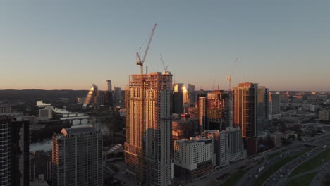 Skyscraper-construction-with-cranes-and-high-rise-buildings-in-modern-American-city