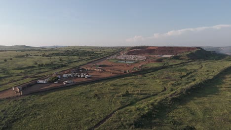 A-surveying-drone-shot-of-a-sizable-waste-processing-site-in-the-region-of-Pretoria,-South-Africa