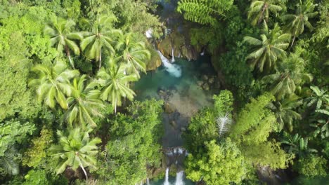 One-of-the-most-known-waterfalls-in-the-Pilippines,-enjoy-the-flight-over-it-and-the-river-along-the-way